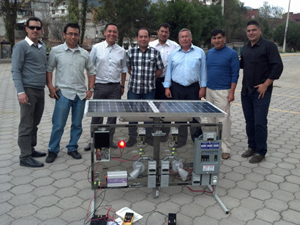 Instructors with the solar energy technology panel at Universidad Politecnica Salesiana