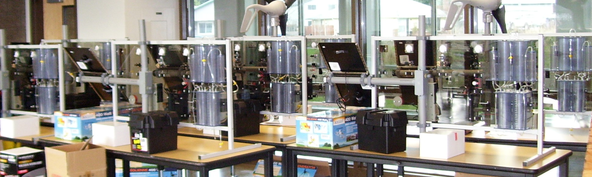 Several tables filled with GT-1500 panels from the introductory course of generating clean electrons